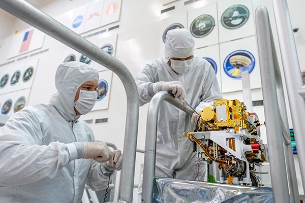 July 02, 2019 Engineers install the SuperCam instrument on Mars 2020's rover. This image was taken on June 25, 2019, in the Spacecraft Assembly Facility at NASA's Jet Propulsion Laboratory, Pasadena, California
